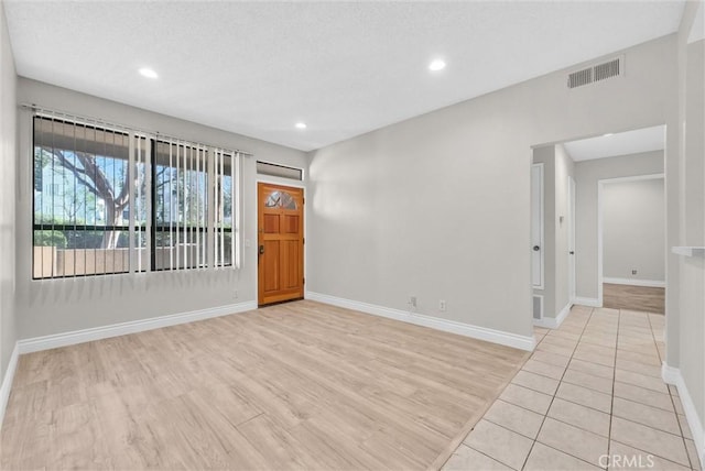 unfurnished room featuring light hardwood / wood-style floors