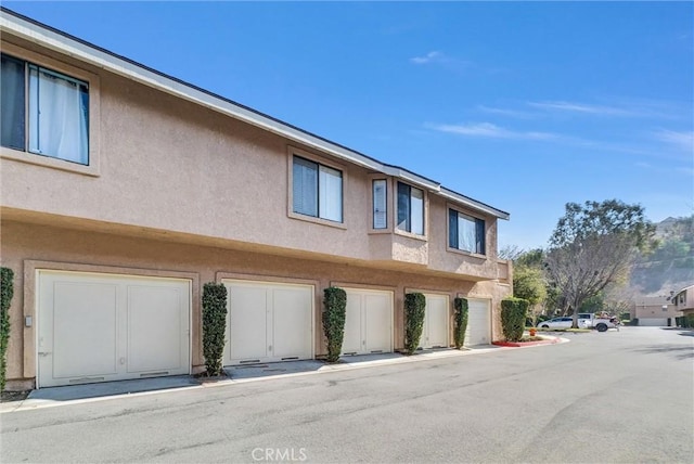 view of building exterior with a garage