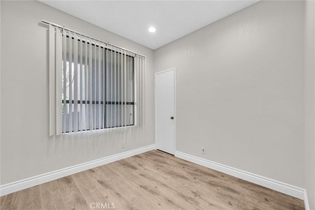 spare room with light wood-type flooring