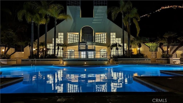 view of pool at night