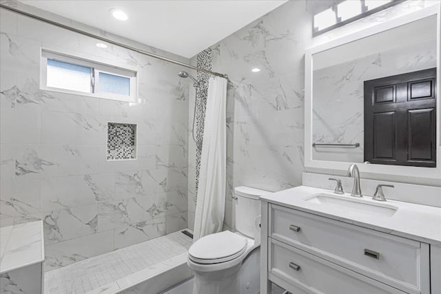 bathroom featuring walk in shower, vanity, and toilet