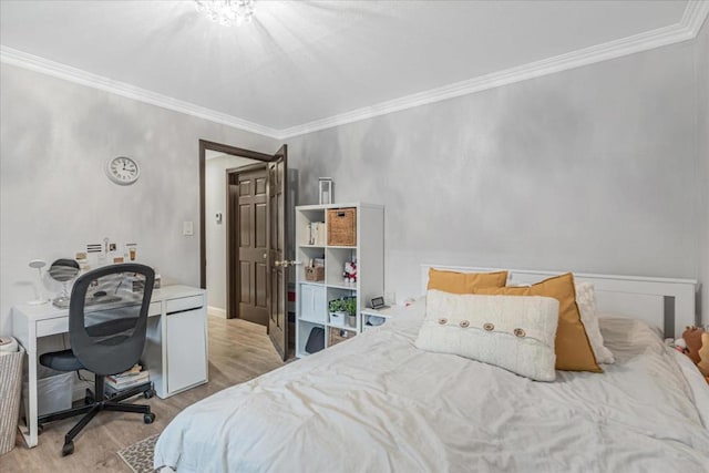 bedroom featuring ornamental molding and light hardwood / wood-style flooring