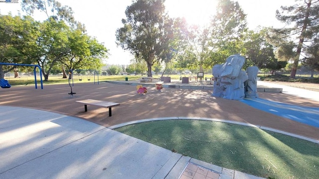 view of property's community with a playground