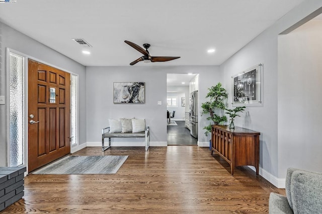 foyer entrance featuring ceiling fan and dark hardwood / wood-style flooring