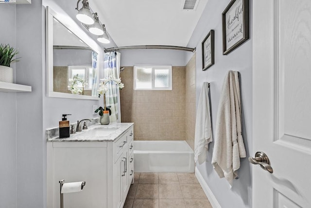 bathroom featuring vanity, tile patterned flooring, and shower / bath combo