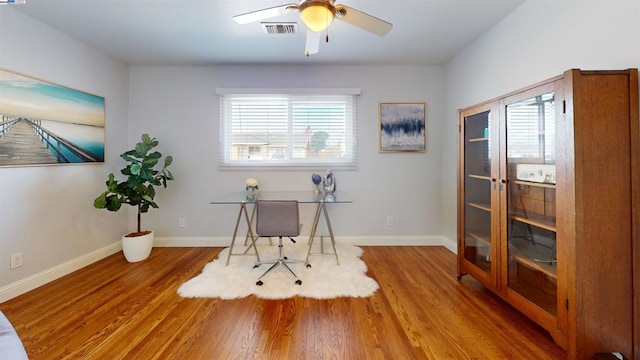 office area with ceiling fan and wood-type flooring