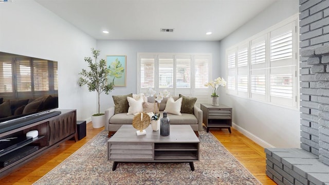 living room with light hardwood / wood-style flooring