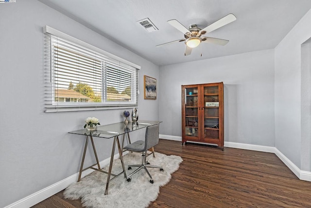 office space featuring ceiling fan and dark hardwood / wood-style flooring