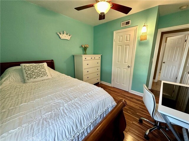 bedroom featuring ceiling fan and wood-type flooring