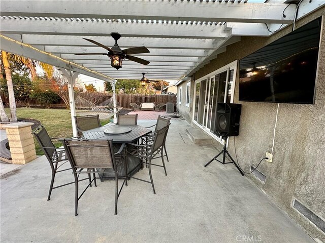 view of patio with ceiling fan and a pergola