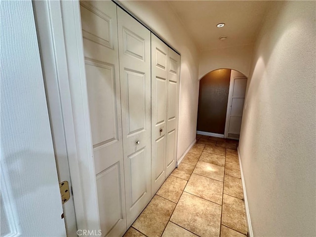 hallway with light tile patterned floors