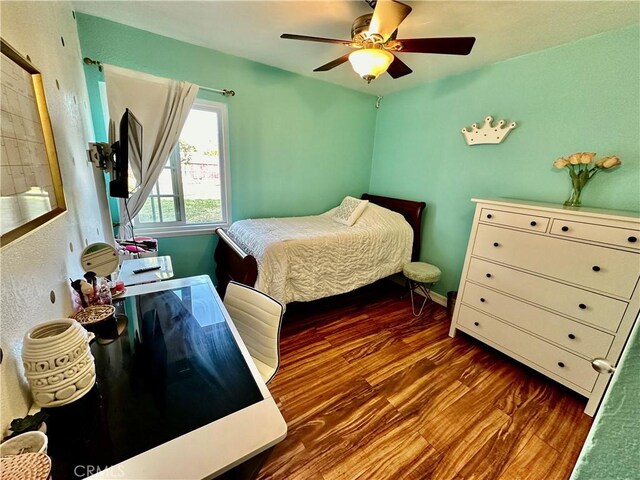 bedroom featuring dark hardwood / wood-style flooring and ceiling fan