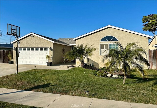 ranch-style home with a garage and a front yard