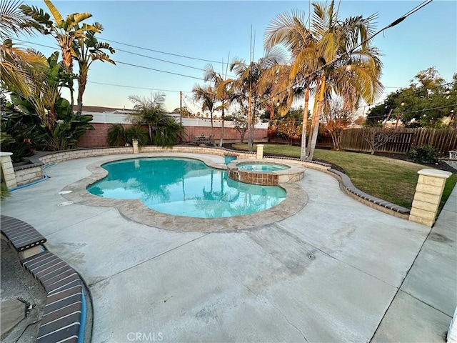 view of swimming pool featuring an in ground hot tub and a patio area