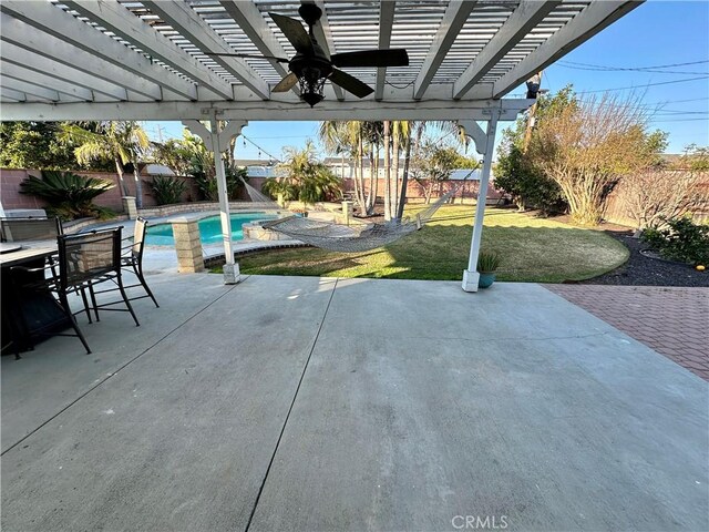 view of patio with a fenced in pool, ceiling fan, and a pergola