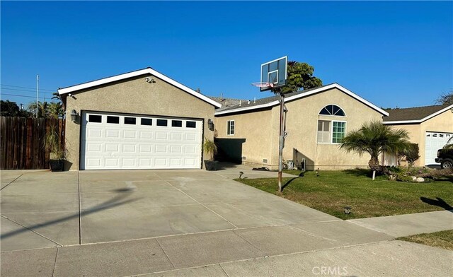 single story home with a garage and a front yard