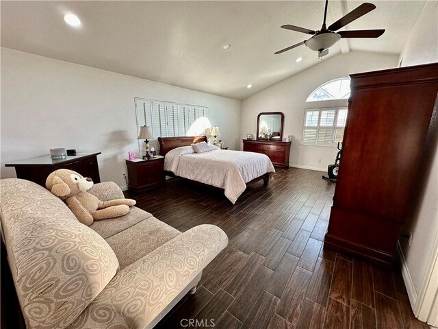 bedroom with dark hardwood / wood-style flooring, vaulted ceiling, and ceiling fan