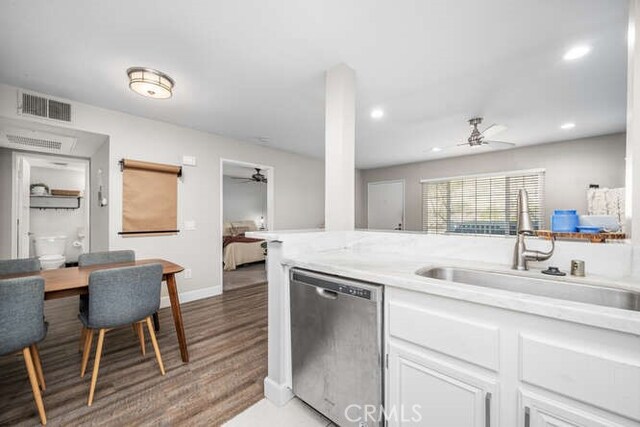 kitchen featuring sink, light hardwood / wood-style flooring, dishwasher, ceiling fan, and white cabinets