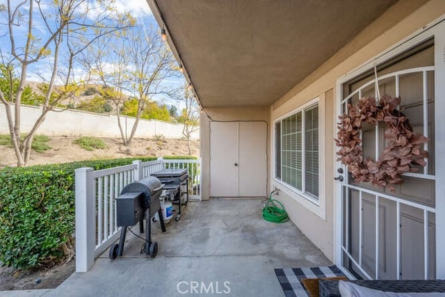 view of patio with fence