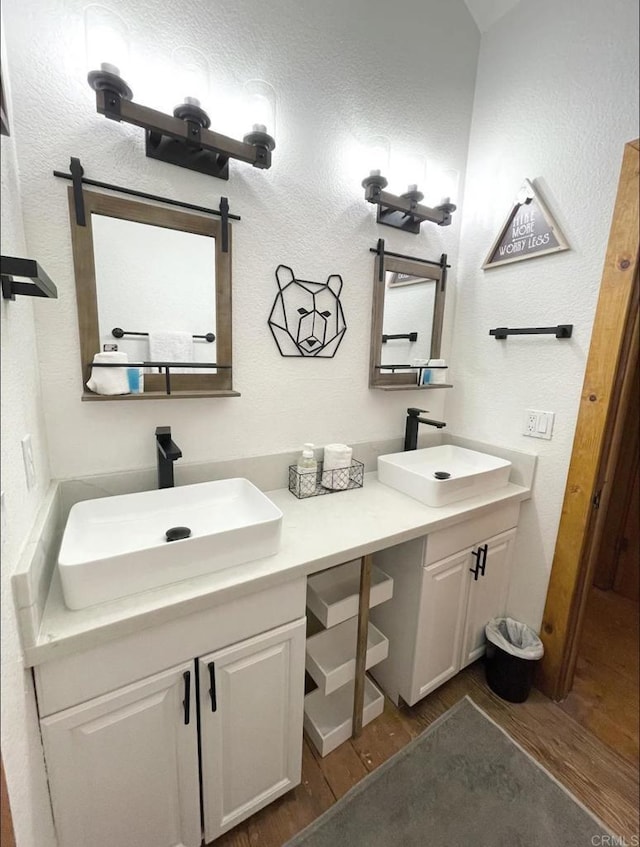 bathroom with vanity and hardwood / wood-style flooring