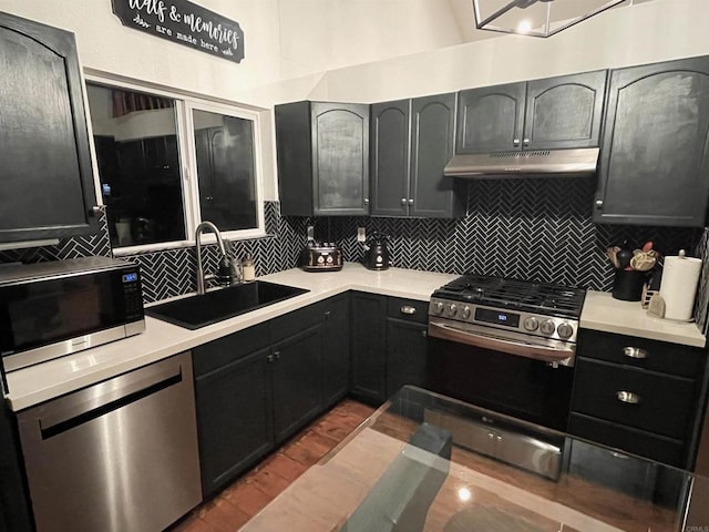 kitchen with stainless steel appliances, tasteful backsplash, and sink