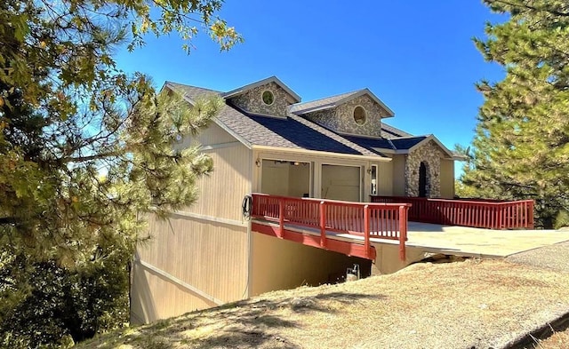 view of front facade featuring a wooden deck