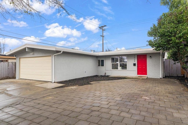 ranch-style house featuring a garage