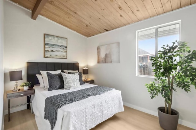 bedroom featuring wood ceiling, light hardwood / wood-style floors, and lofted ceiling with beams