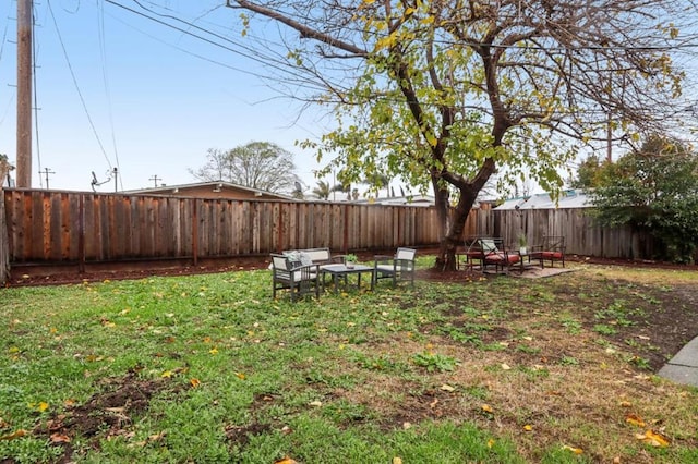 view of yard featuring outdoor lounge area and a patio