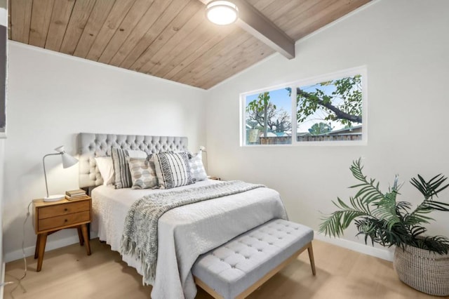 bedroom with vaulted ceiling with beams, light hardwood / wood-style flooring, and wooden ceiling