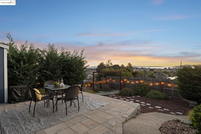 view of patio terrace at dusk