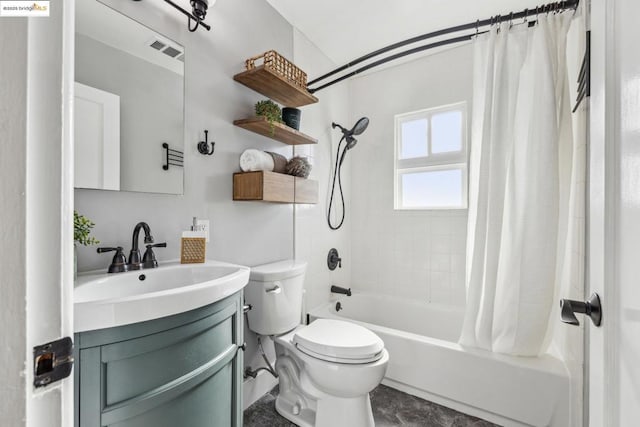 full bathroom featuring shower / tub combo, vanity, and toilet