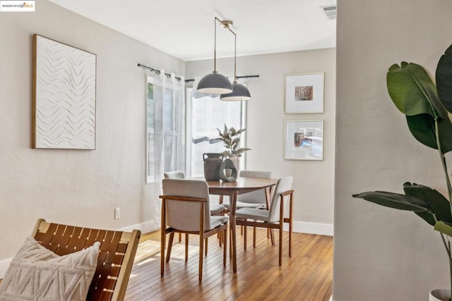 dining room with hardwood / wood-style floors