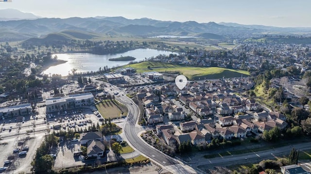 bird's eye view with a water and mountain view