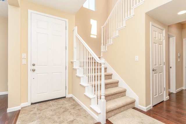 foyer entrance with hardwood / wood-style flooring