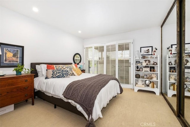 carpeted bedroom with lofted ceiling