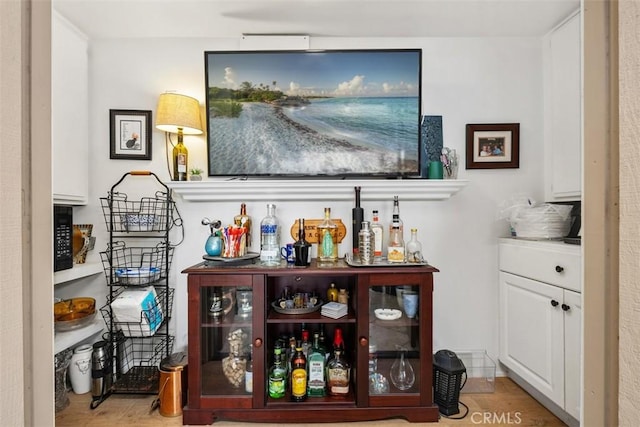 bar with white cabinetry