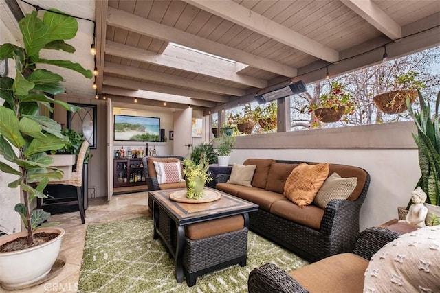 exterior space with wood ceiling, beam ceiling, and a skylight