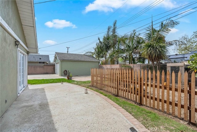 view of patio / terrace featuring a fenced backyard and an outdoor structure
