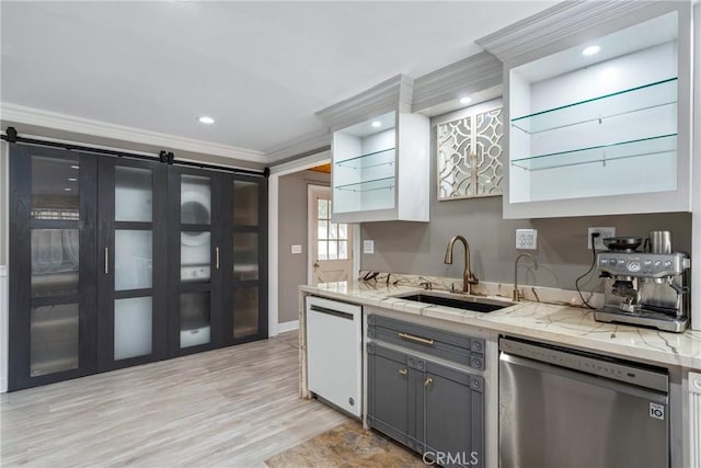 kitchen with crown molding, dishwasher, a sink, and recessed lighting