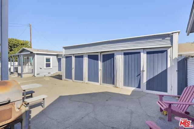 exterior space with an outbuilding and grilling area