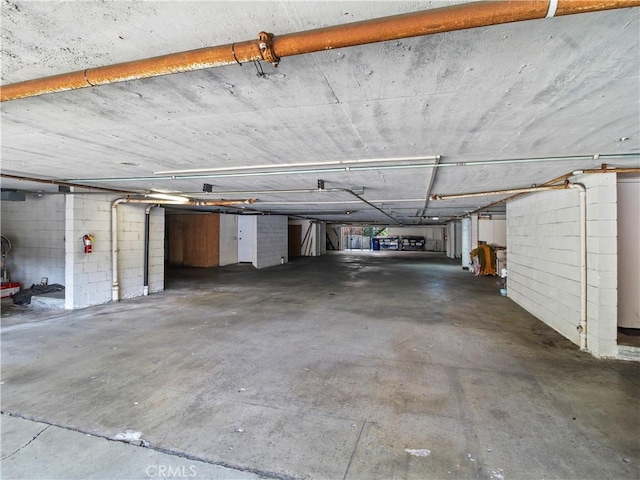 parking garage featuring concrete block wall