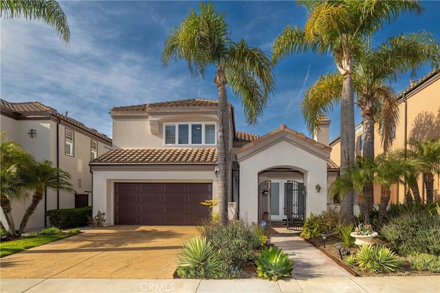 mediterranean / spanish house featuring a garage