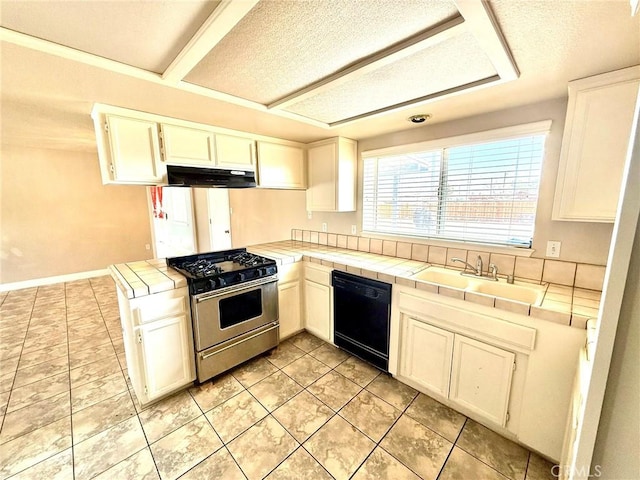 kitchen featuring stainless steel range with gas cooktop, black dishwasher, tile countertops, and white cabinets