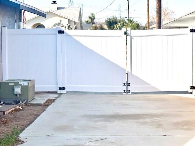 view of gate with fence