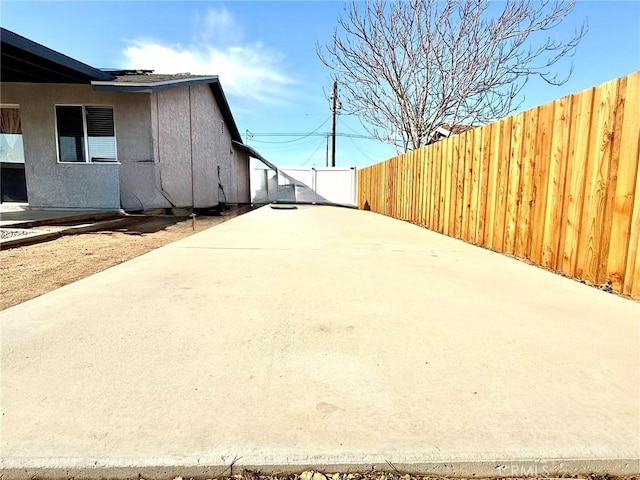 view of yard with a patio and fence