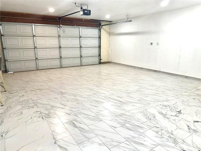 garage featuring recessed lighting, a garage door opener, and baseboards