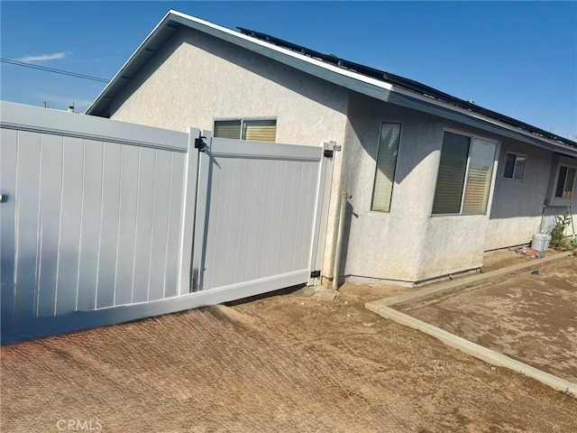 view of home's exterior with stucco siding