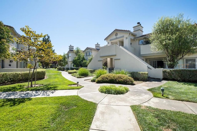 view of community featuring a lawn