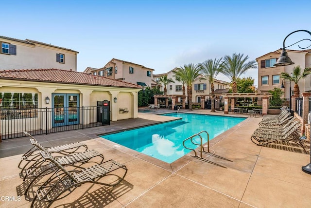 view of swimming pool featuring a patio and a pergola